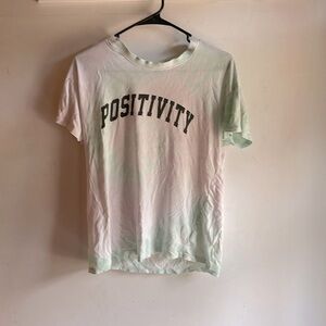 This is a pink and teal very light tie die tee shirt